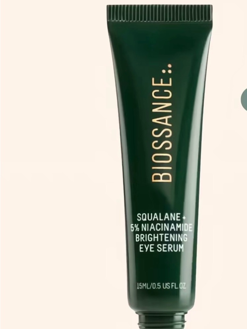Biossance Deep Green Eye Serum Tube with Gold Lettering